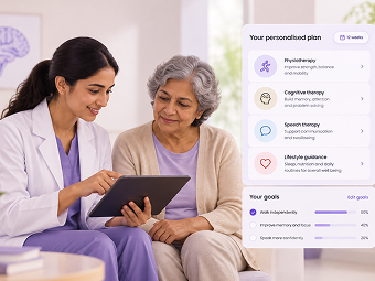 Therapist and patient agreeing goals on a tablet