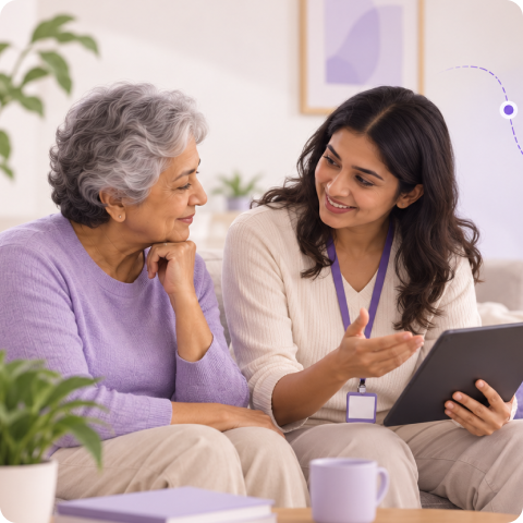 Care Navigator listening warmly to a mother and son at their dining table